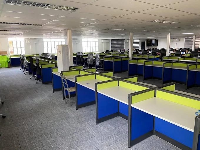 A large Metacom operations floor with rows of workstations