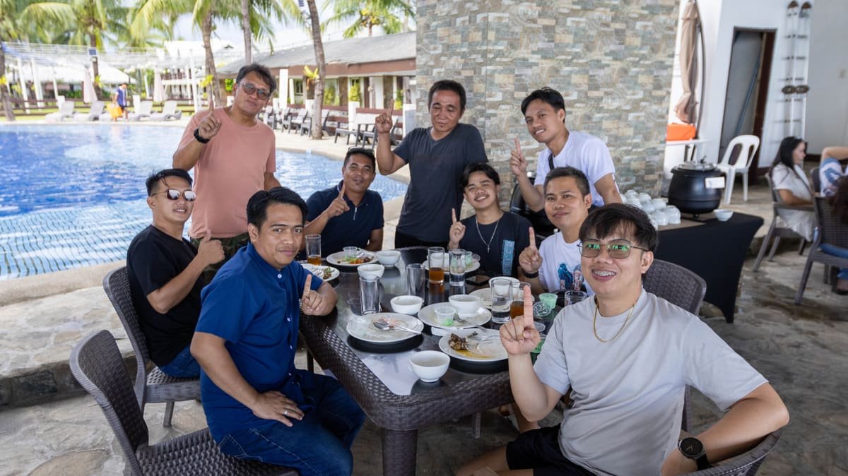 The Metacom team celebrating together poolside