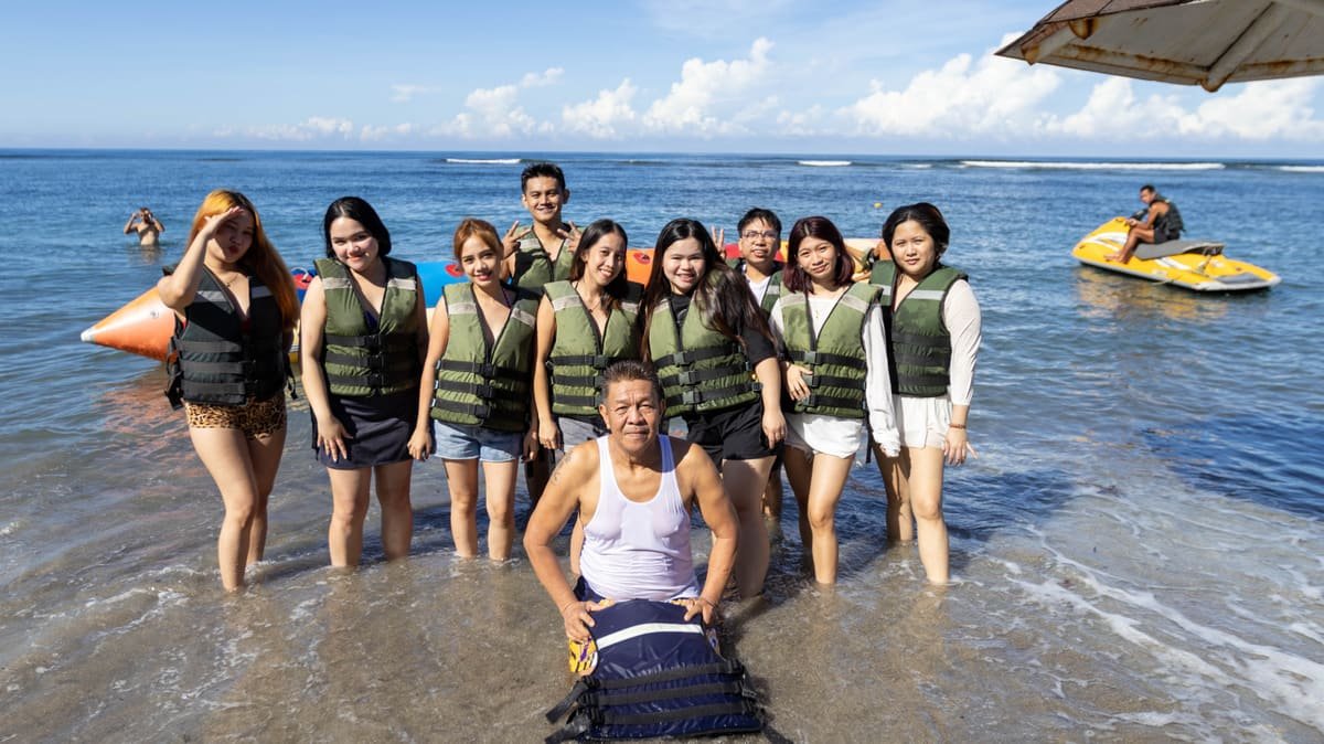 The Metacom team wearing life vests on a beach outing