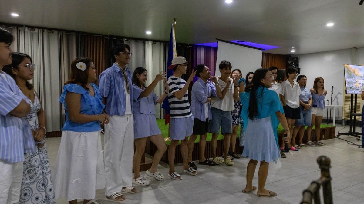 The Metacom team singing and dancing at a company event