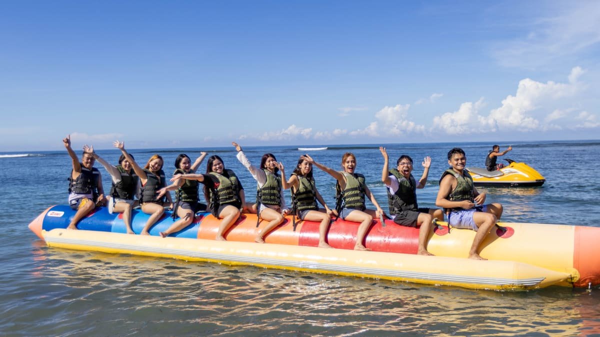 The Metacom team riding a banana boat together